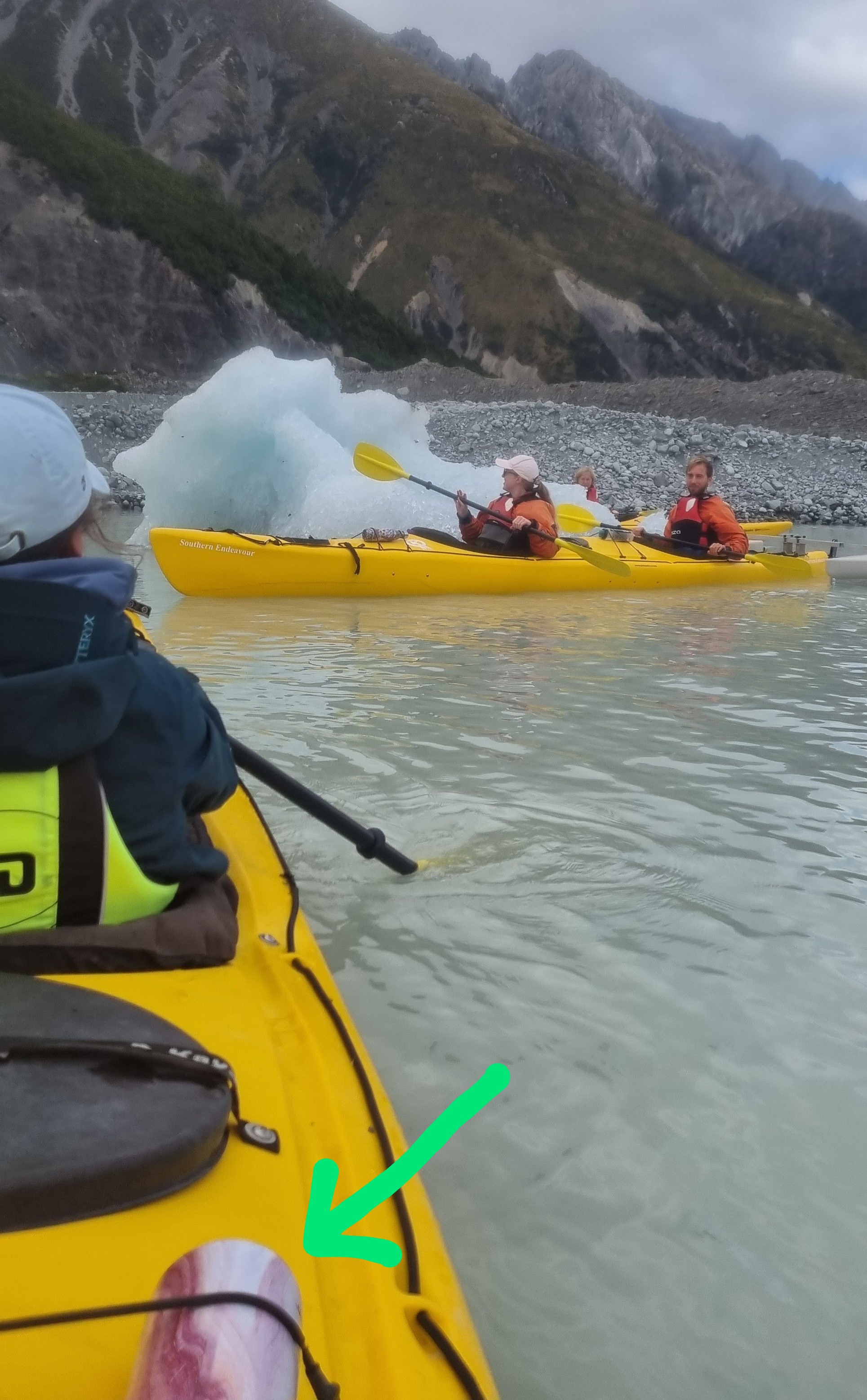 reusable water bottle tied onto a canoe on a glacier lake in New Zealand